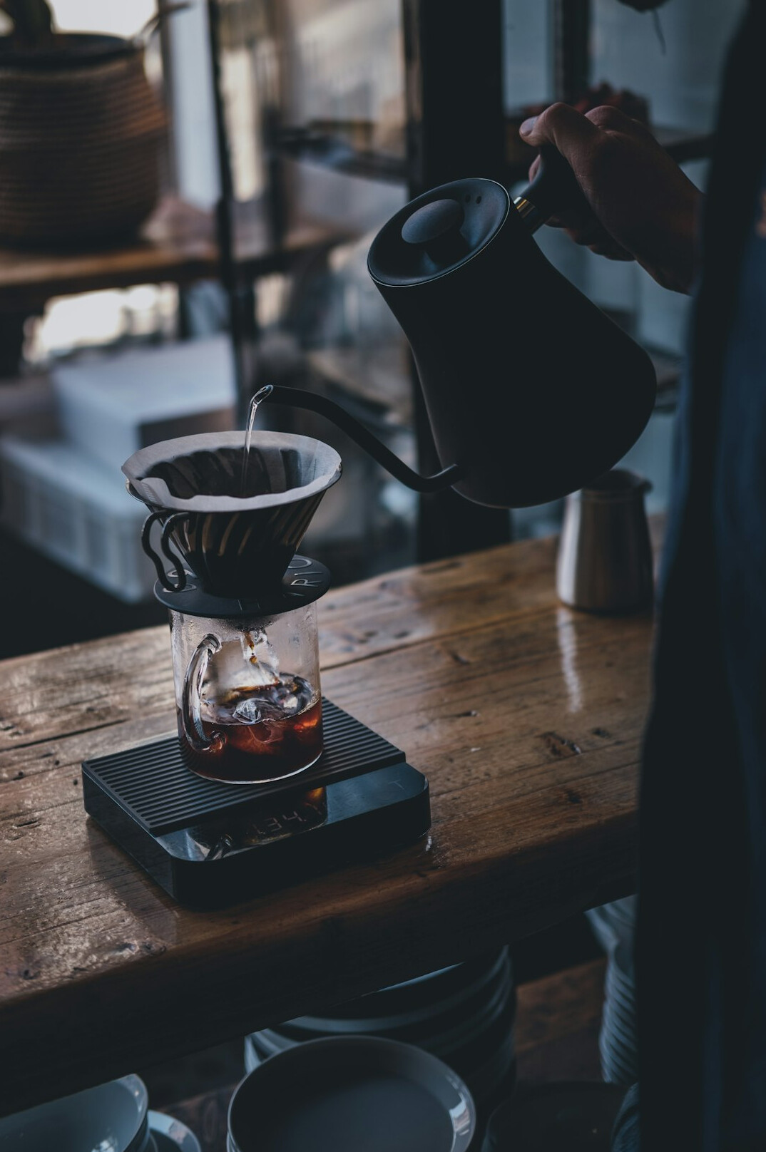 barista pouring coffee