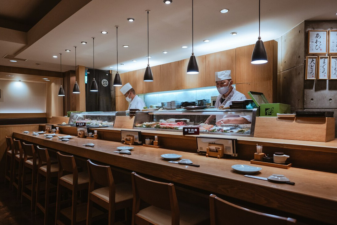Elegant Japanese restaurant interior with wooden counter and lanterns